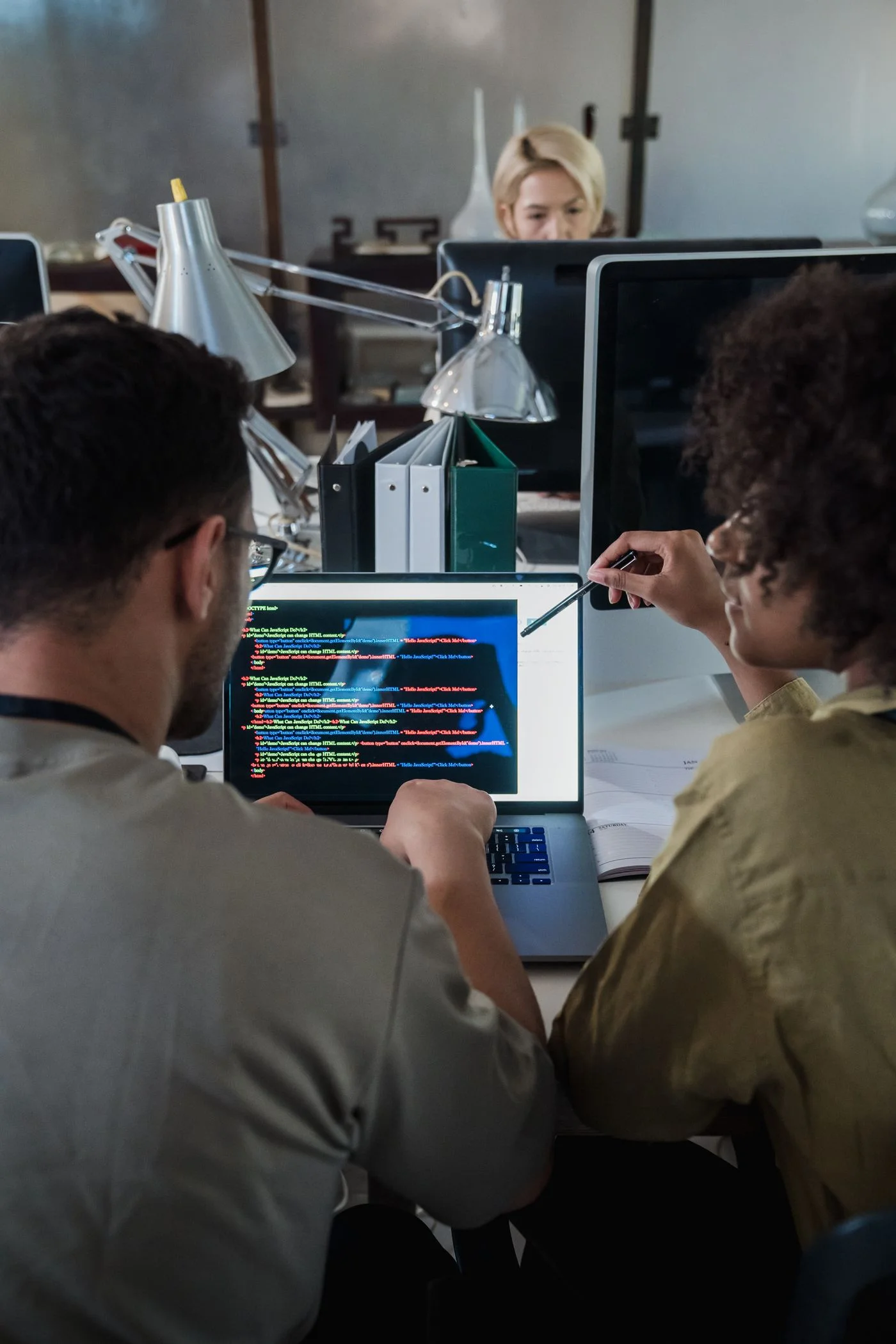 Developers discussing software architecture, a stock photograph