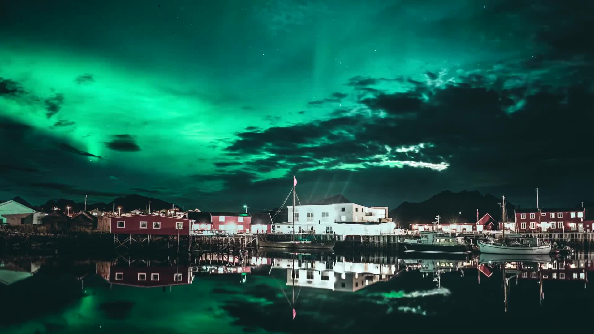 Northern lights over a coastal town