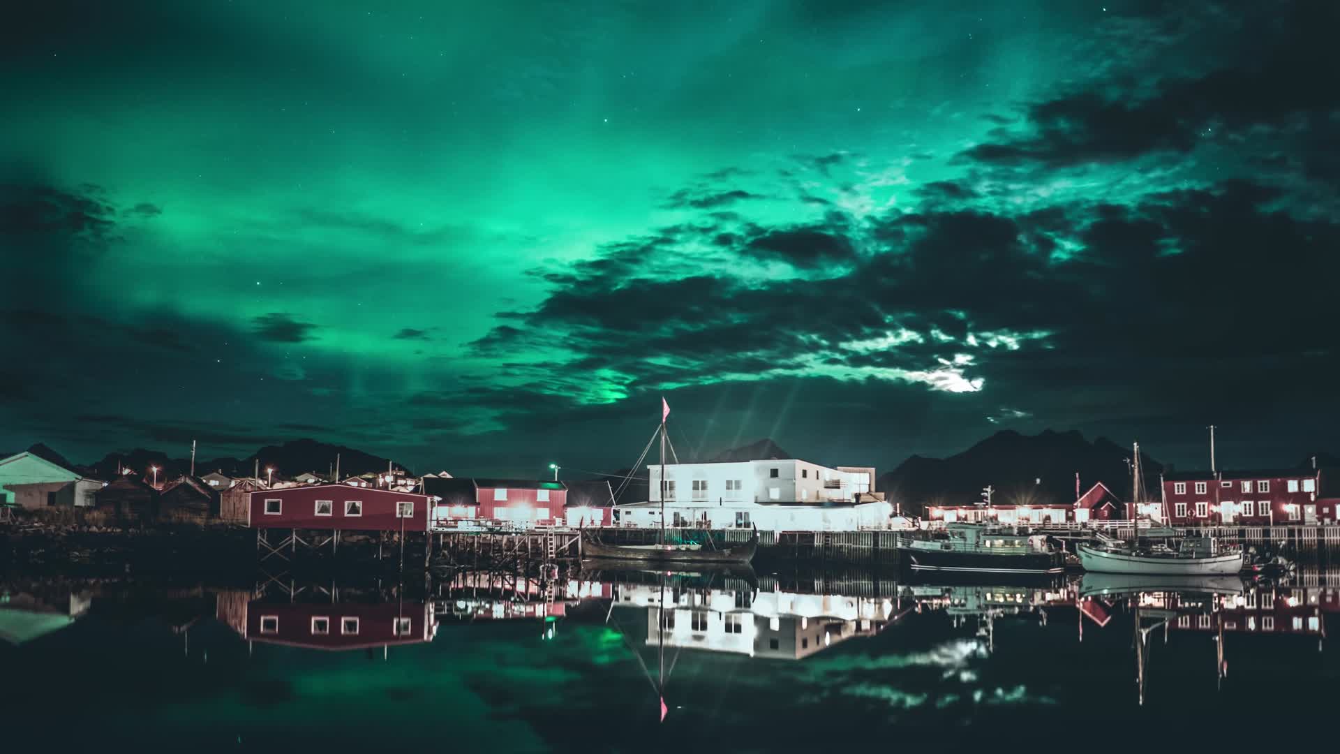 Northern lights over a coastal town