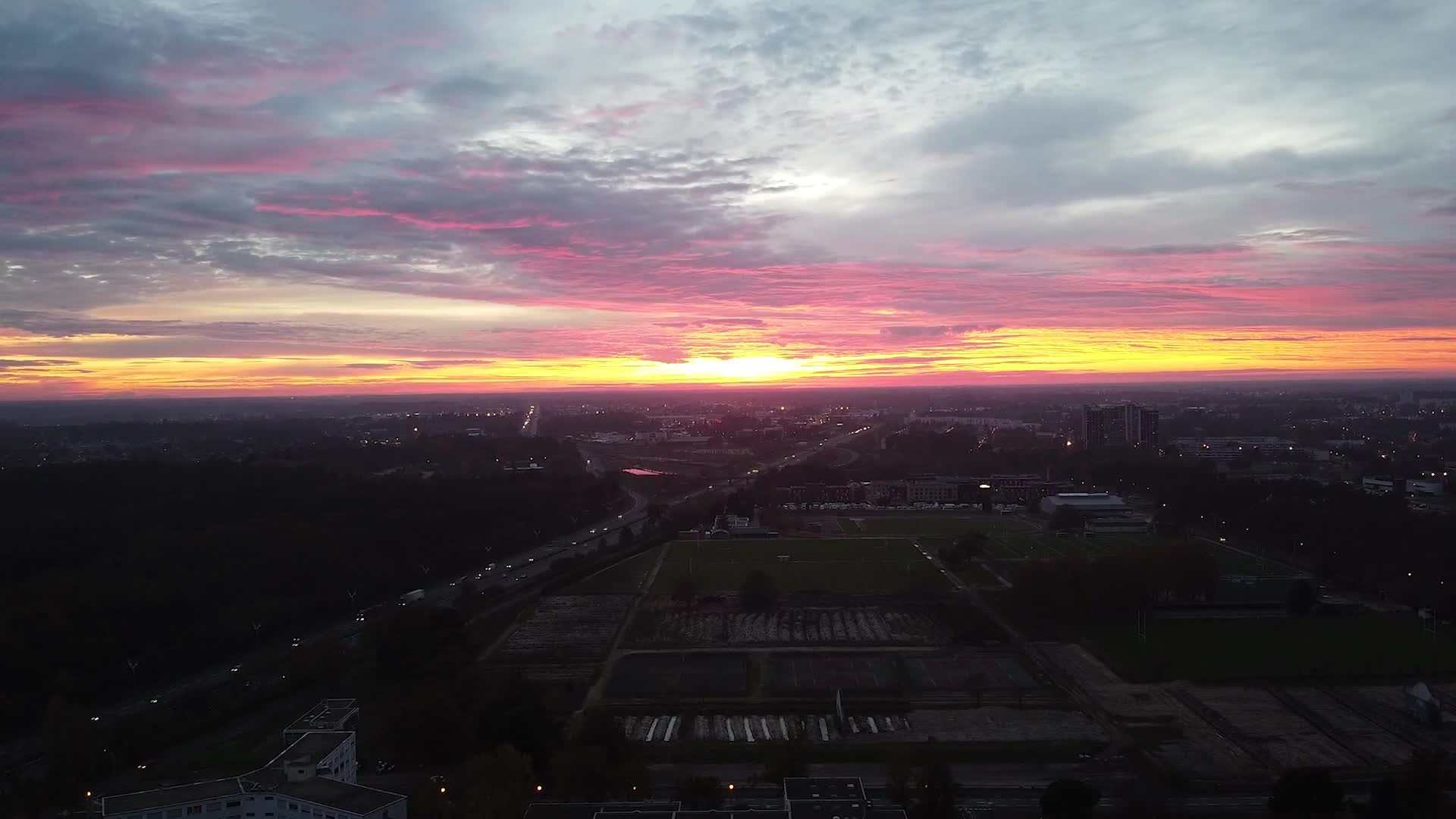 City skyline beneath a colourful sunset