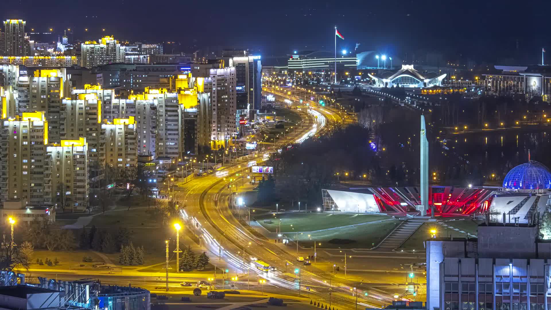 Vivid city lights and flowing traffic at night