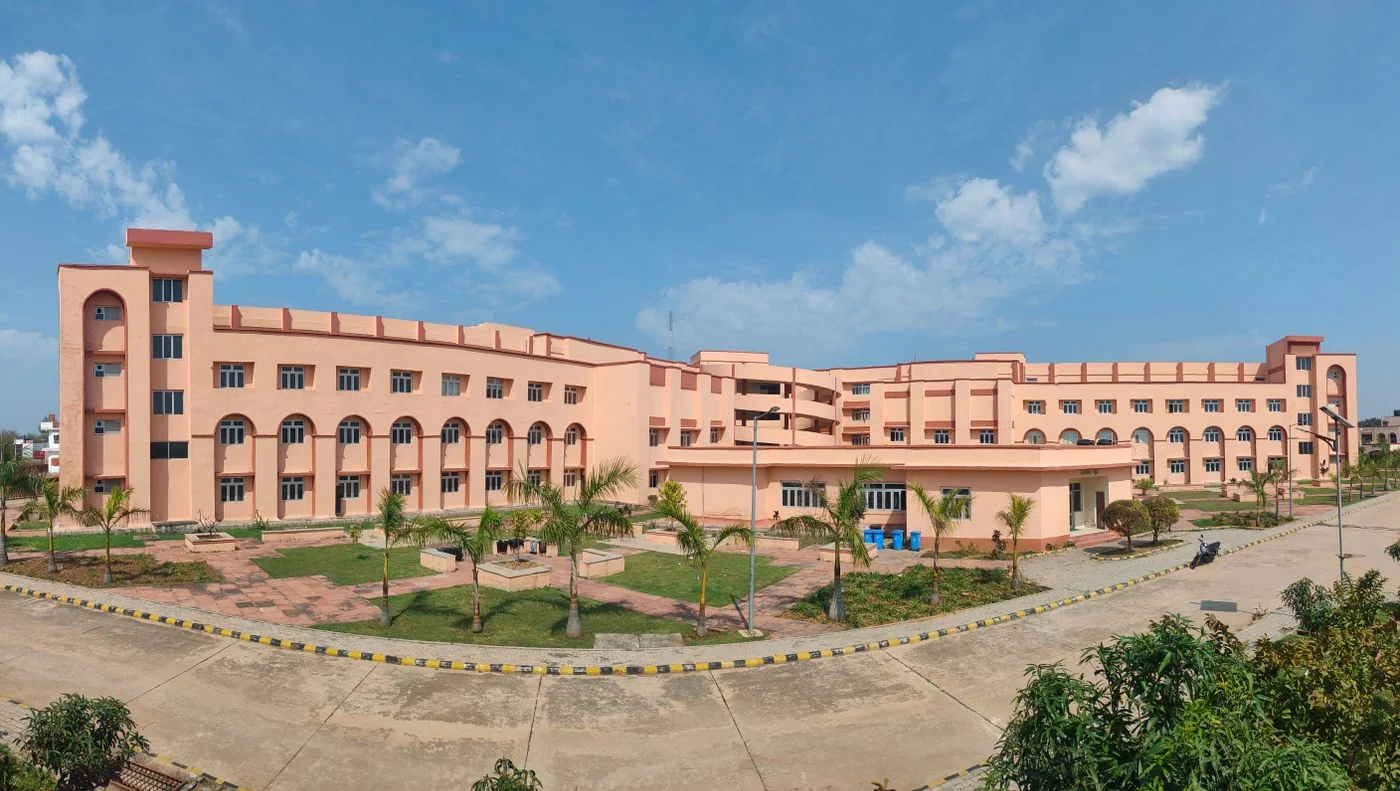 Indian university campus building surrounded by greenery